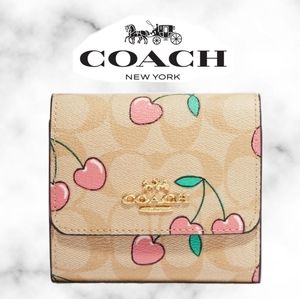 Coach Small Trifold Wallet In Signature Canvas With Heart Cherry Print